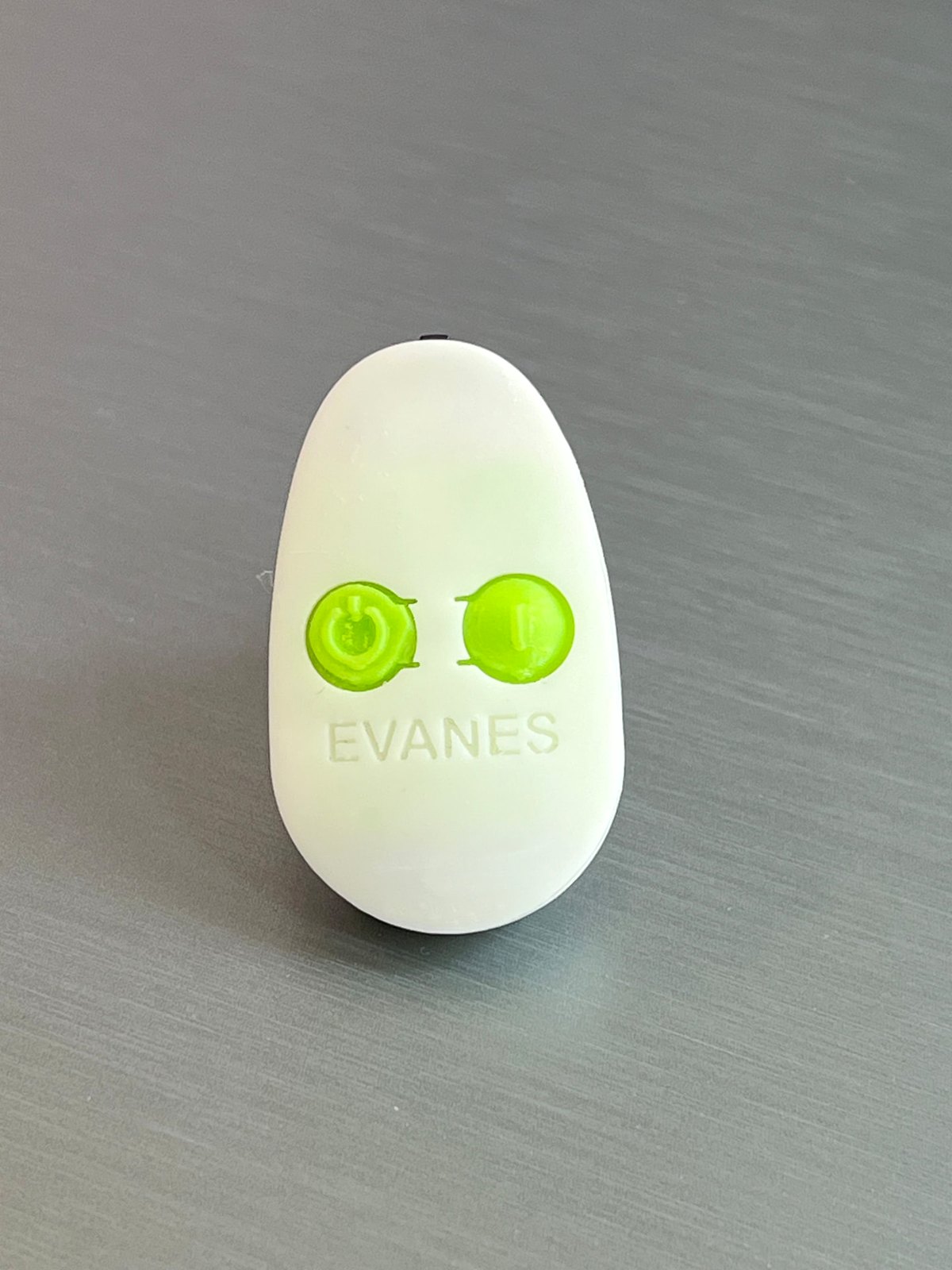 Real EVANES device showing its two green buttons