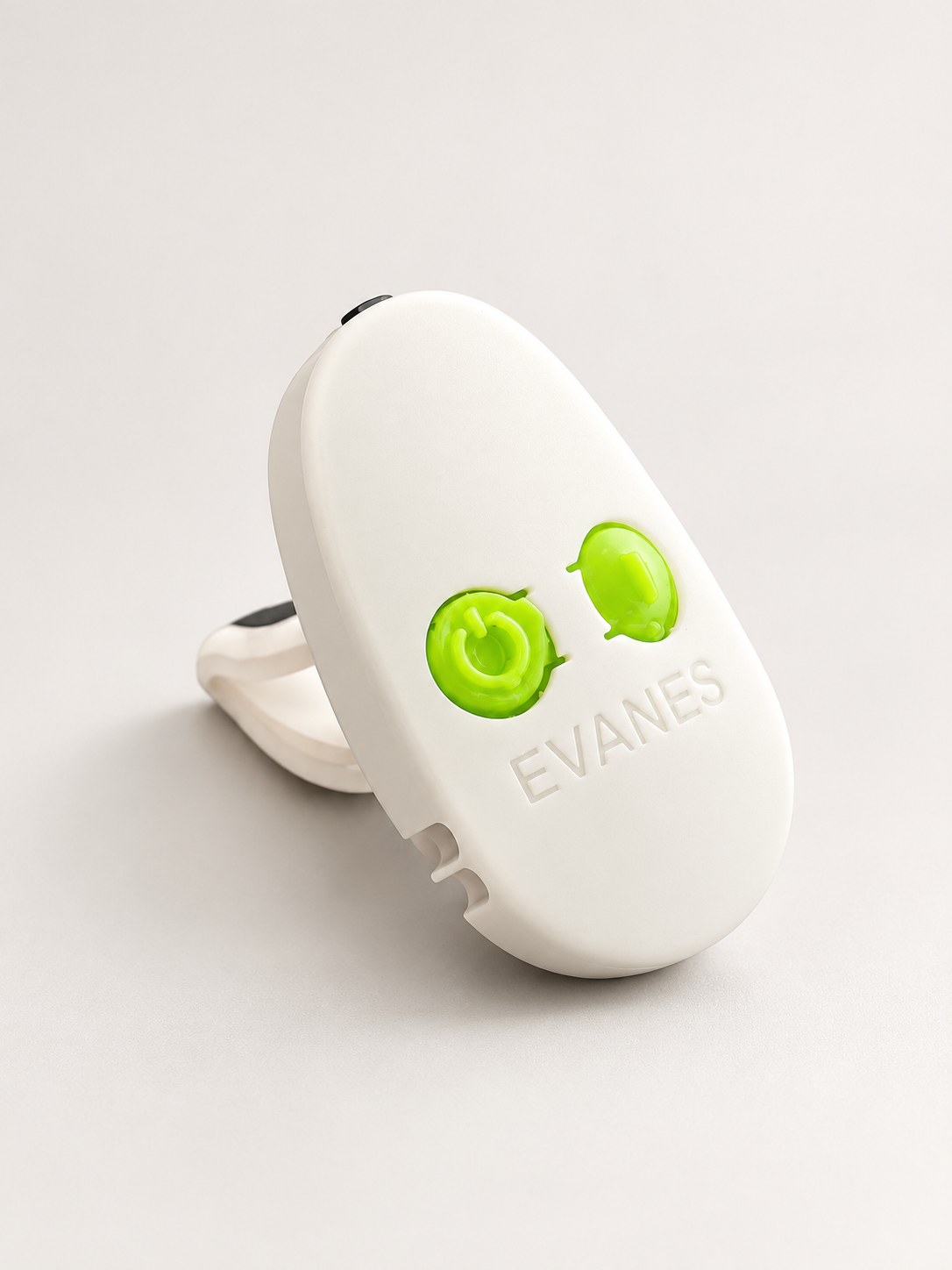 EVANES vagus nerve stimulator seen from the front, its two green buttons facing the camera